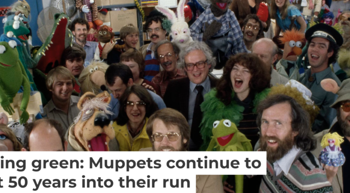 The artists and crew behind the ‘The Muppet Show,’ including Muppet creator Jim Henson, third from right in the front row, gather for the camera. Nancy Moran/Sygma via Getty Images